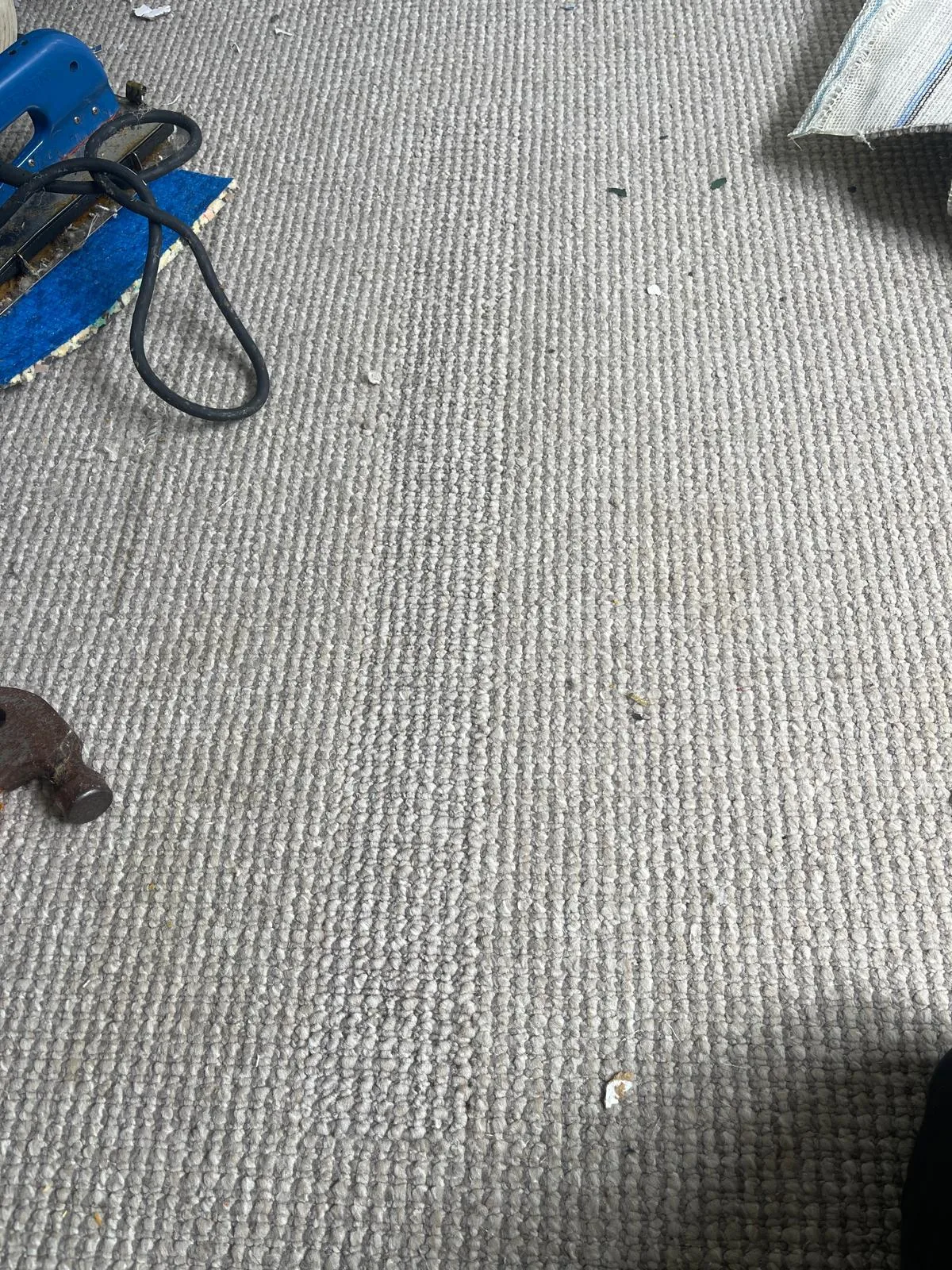 The same carpet after expert patch repair with seams blended to be nearly invisible.